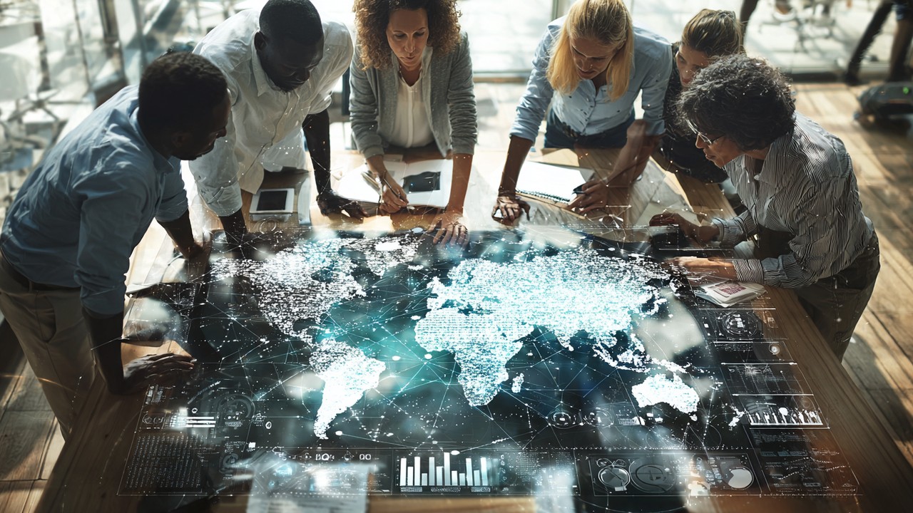 Diverse professionals collaborating around a digital world map with SEO analytics overlays in a modern office environment.