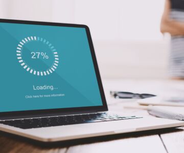 Close up of freelancer laptop with loading bar on screen