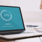 Close up of freelancer laptop with loading bar on screen