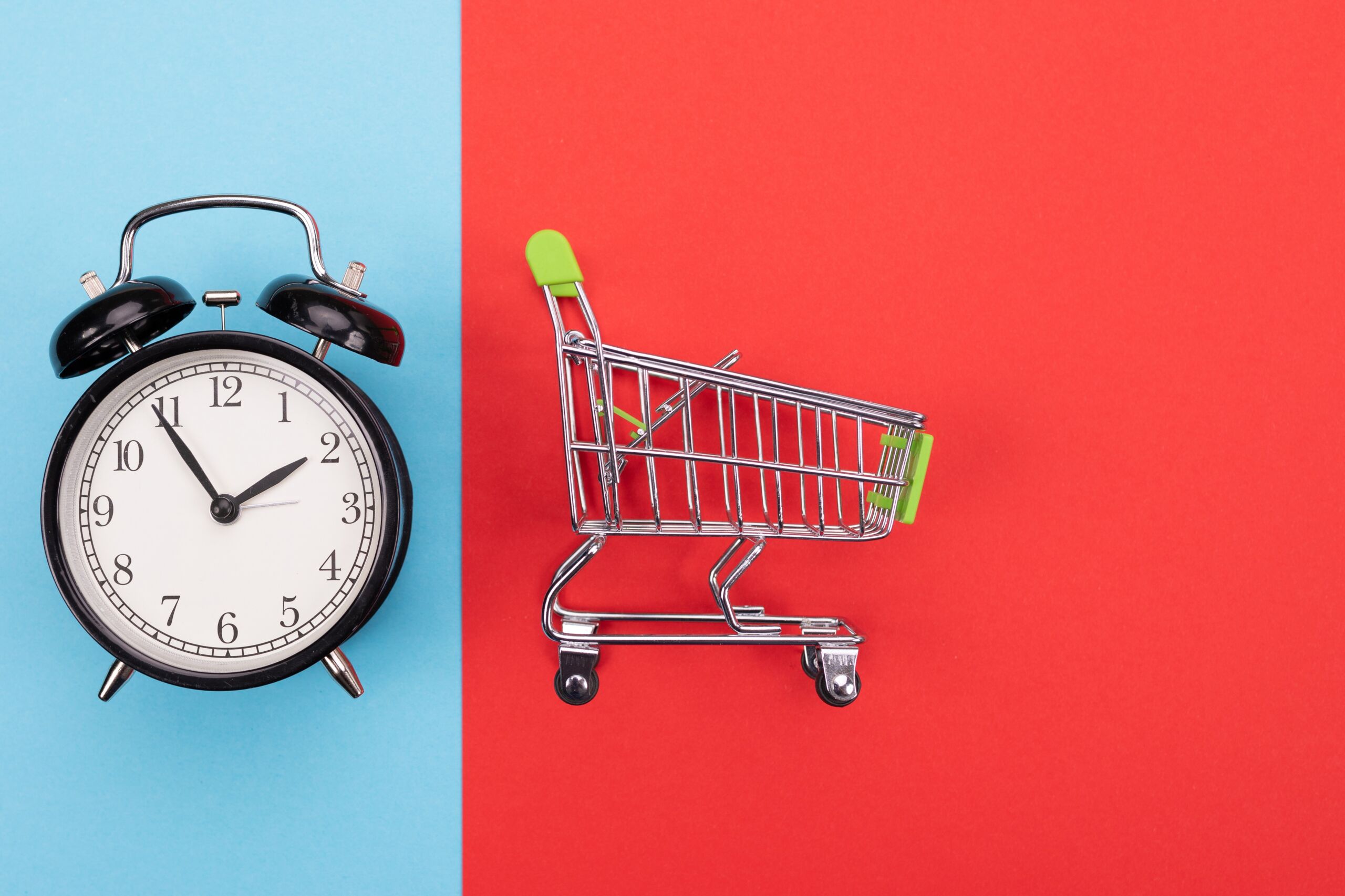 supermarket cart with green handle on colorful background